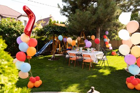 design of the children birthday balloons on the street in the summer