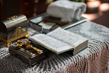 an Orthodox church. prayer book at a wedding or baptism. without a face.