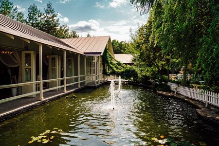 the fountains in the pond near the gazebo in the Park. exterior.の写真素材