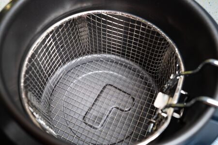 basket for home mini deep fryer without oil. view top. cook at home.