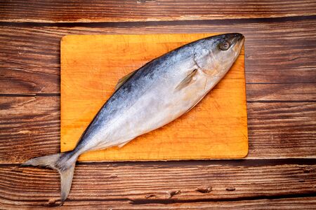 raw mackerel. prepare dishes from fish and seafood. wooden backgroundの写真素材