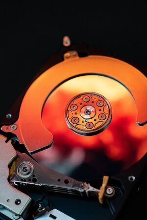 Disassembled hard drive from the computer, hdd with mirror effect. Opened hard drive from the...