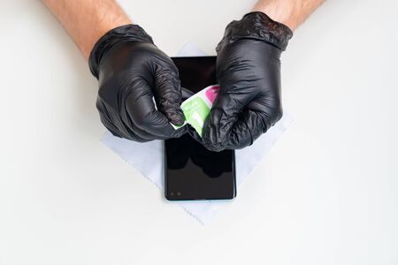 installation of protective cover film on the smartphone. Maintenance support and repairing service concept.の写真素材