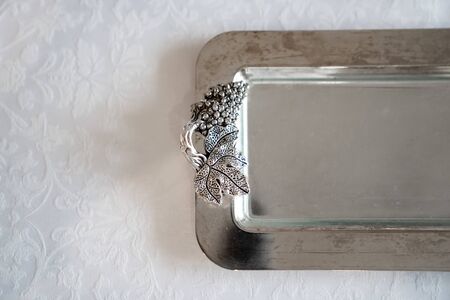 shiny metal handout tray. the design element of the festive table. beautiful tableware. copy space.の写真素材