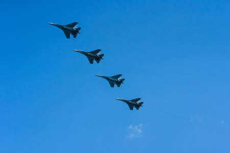 28.04.2020 Russia Rostov-on-don A group of professional pilots of military aircraft shows tricks in the sky. Rehearsal of victory day parade in Russia. In sunny spring summer, clouds float on the blue sky. good cloud weather.のeditorial素材