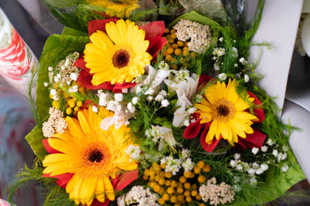 top view of bouquets of fresh yellow flowers. a gift for a holiday or anniversary.