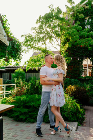 beautiful and happy couple having fun in the garden in the courtyard. honeymoon on vacation.の写真素材