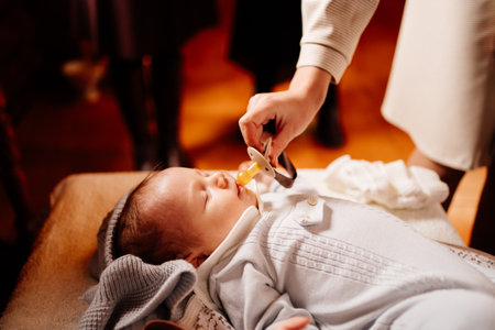 a baby fell asleep on a dressing table in a Church. the ordinance of baptism.の写真素材