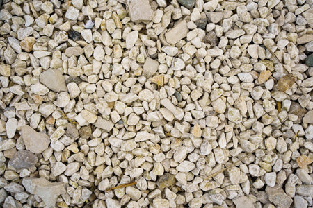 grey pebbles. background and texture of stones. covering roads and pathsの写真素材