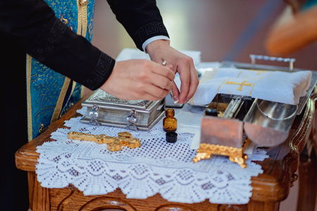 priest prepares for Chrismation is Sacrament. Christianの写真素材