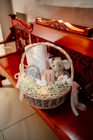 basket with a set for the baptism of a little girl.の写真素材