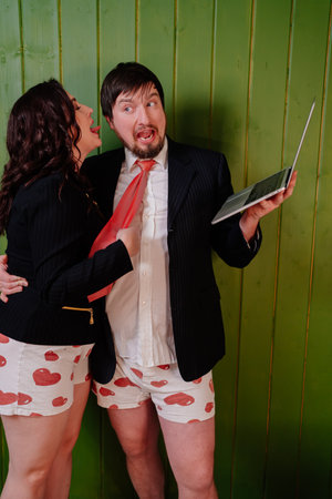 a cheerful couple in shorts and jackets are broadcast live. online conference.