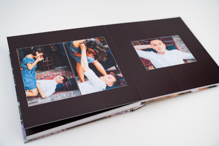 pages of photobook from photo shoots of a beautiful happy couple in retro house.の写真素材