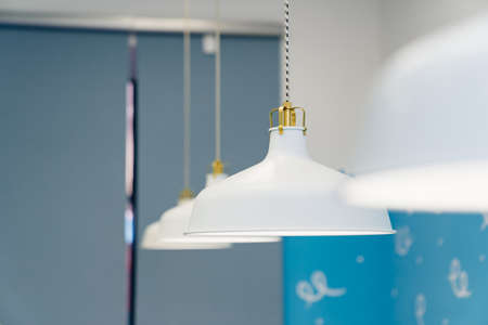 simple white hanging chandeliers in the room.