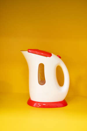 toy little white with red electric kettleの写真素材