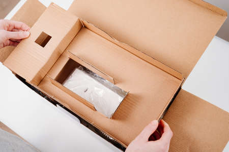 unpacking boxes with an order from an online store.の写真素材