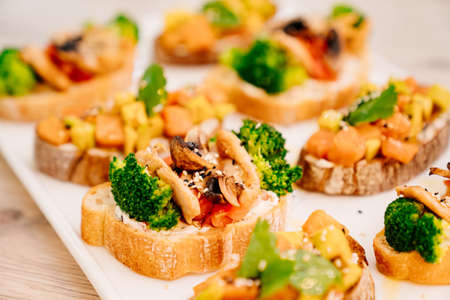serving the table with sandwiches on bruschetta for the holiday.
