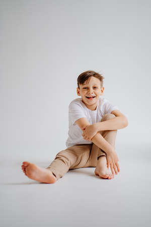 happy childhood. boy in pose in a photo studio. problems for teenage boys.の写真素材