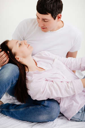 couple man and woman in white photo studio. family psychotherapy.