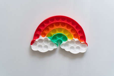 multi-colored anti-stress toy in the shape of a rainbow.の写真素材
