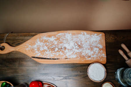 cutting board covered with flour for cooking dishes from dough.の写真素材