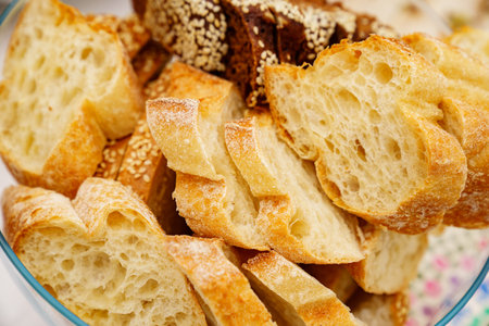 bread cut into pieces. flour products. recipe for yeast doughの写真素材