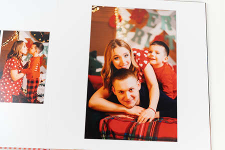pages of photobook from a new years family photo shoot