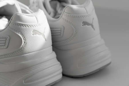 puma. part of white sneakers on a white background.のeditorial素材
