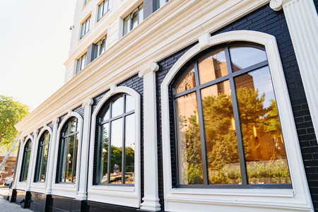 exterior of the first floor of a multi-storey building. large windows.