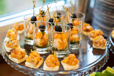 mini seafood sandwiches and shrimp in small cups. delicious snacks.の写真素材