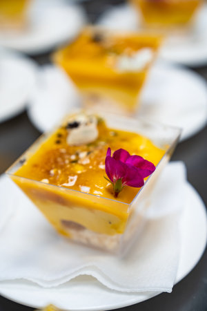Catering. kremenki with fruit desserts decorated with flowers.の写真素材
