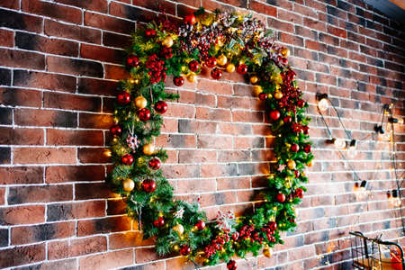 beautiful big New Years wreath on a brick wall.の写真素材
