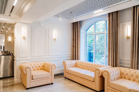 hall, a place to wait. white leather sofas for home and office.の写真素材