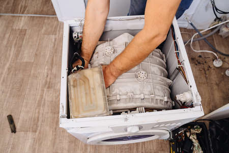 repair of household appliances at home with their own handsの写真素材