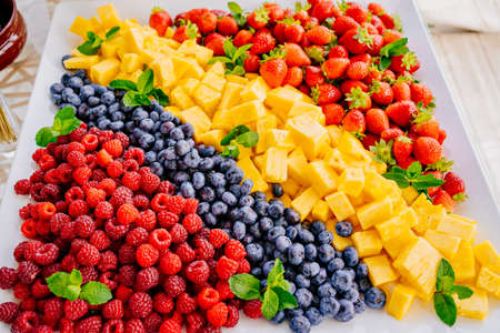 fruit assorted. raspberries, blueberries, pineapple and strawberriesの写真素材