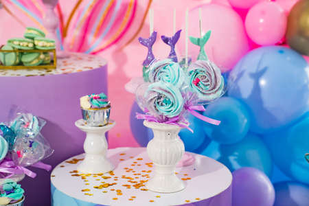 candy bar in a nautical style with a candle number five.の写真素材