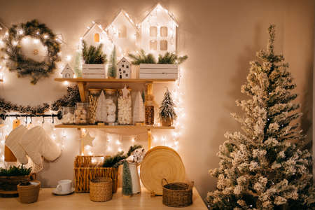 Christmas decor. garlands on shelves on decorated in kitchen for new year.の写真素材