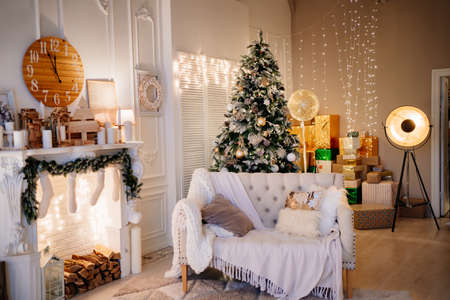 New Years atmosphere. an armchair by the fireplace decorated for the New Year.の写真素材