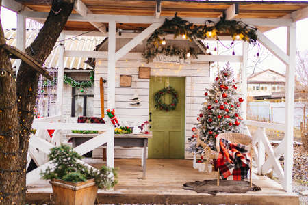 the tradition of decorating the house for Christmas. Christmas tree on the porchの写真素材