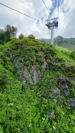 cable car in the mountains. summer tourism.の写真素材