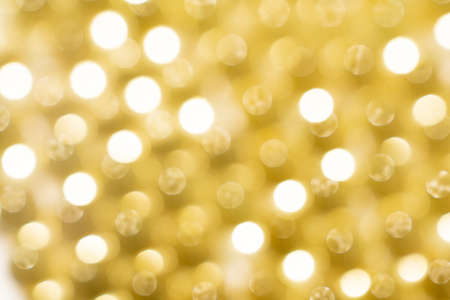 out of focus. background. yellow gelatine capsules. pharmaceutical production.の写真素材