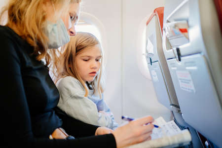 mother and daughter decide a mathematical crossword.の写真素材