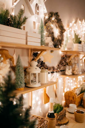side view. Christmas decor. garlands on decorated in kitchen for new year.の写真素材