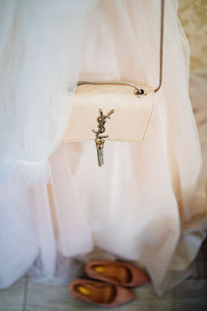 original brand bag Yves Saint Laurent on the wedding dress.のeditorial素材