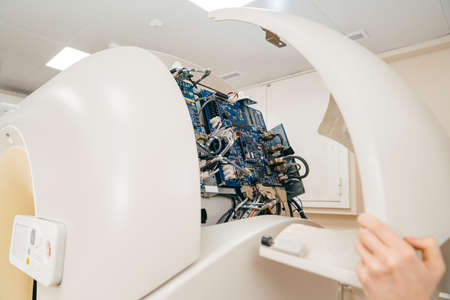 engineer removes cover of a computer tomograph.の写真素材