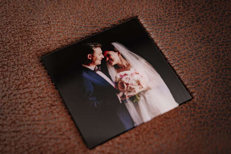 cover of wedding photobook in brown leather binding with photosの写真素材