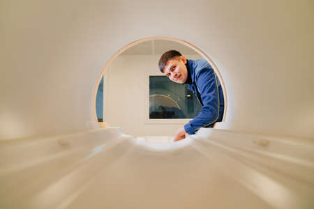 installer engineer of mri apparatus in scanner. blue uniformの写真素材