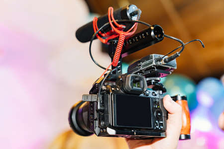 video camera in the hands of the videographer.の写真素材