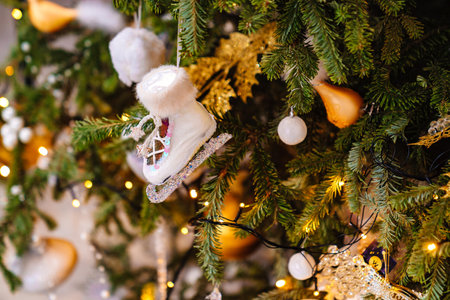 skates. part of the Christmas tree with vintage toys and an electric garland.の写真素材