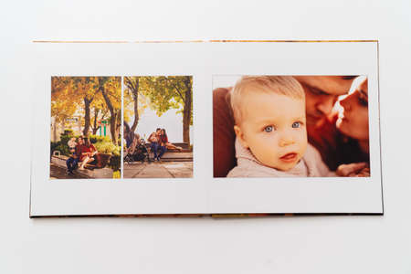 pages of a photobook from a family photo shoot.